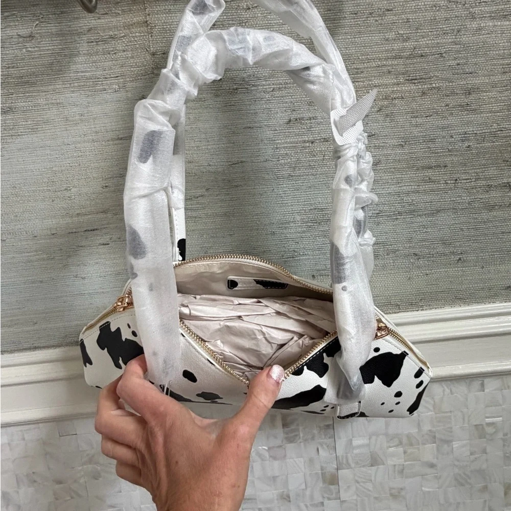 NWT new Anthropologie melie bianco east west shoulder bag cow print black white
